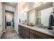 Bathroom boasts dual sinks with granite countertops and a separate shower at 811 W 128Th Pl, Westminster, CO 80234