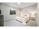 Cozy bedroom featuring neutral carpet, side tables with lamps, and a Queen-sized bed at 811 W 128Th Pl, Westminster, CO 80234