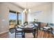 Bright dining space with sliding glass doors leading to an outdoor balcony, perfect for enjoying meals at 811 W 128Th Pl, Westminster, CO 80234