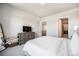 Bright main bedroom boasts neutral tones, a large dresser, and ample closet space at 811 W 128Th Pl, Westminster, CO 80234