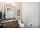 Half bathroom features granite countertops, stylish decor, and modern fixtures at 811 W 128Th Pl, Westminster, CO 80234
