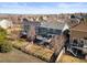 Aerial view of the house showcasing the backyard, deck, and surrounding neighborhood at 16135 Rock Crystal Dr, Parker, CO 80134