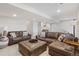 Spacious finished basement featuring recessed lighting, neutral carpet, leather sofas and an ottoman at 16135 Rock Crystal Dr, Parker, CO 80134
