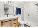 Renovated bathroom features modern vanity, glass-enclosed shower, and contemporary finishes at 16135 Rock Crystal Dr, Parker, CO 80134