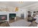 Cozy living room with a fireplace, comfortable seating, and open layout at 16135 Rock Crystal Dr, Parker, CO 80134