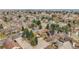 An aerial view captures a well-maintained neighborhood with various home styles and lush greenery in a suburban setting at 2295 S Depew St, Denver, CO 80227