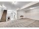 Finished basement with neutral carpet, recessed lighting, and access to a small kitchen at 2295 S Depew St, Denver, CO 80227