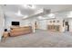 Spacious basement with neutral carpet and a comfortable seating area with a couch and side tables at 2295 S Depew St, Denver, CO 80227