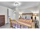 A cozy bedroom showcases a rustic wooden bed frame, soft lighting, and neutral walls, creating a serene atmosphere at 2295 S Depew St, Denver, CO 80227