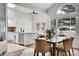 Bright dining area with a glass table set, views of the exterior, and modern finishes at 2295 S Depew St, Denver, CO 80227