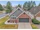 Charming home featuring mixed siding, brick accents, and a two-car garage at 2295 S Depew St, Denver, CO 80227