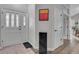 Bright entry foyer featuring a glass front door, and hardwood floors at 2295 S Depew St, Denver, CO 80227