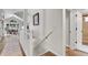 Hallway leading to open concept kitchen and dining area, next to a modern designed bathroom at 2295 S Depew St, Denver, CO 80227