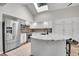 Modern kitchen featuring stainless steel appliances, granite counters and a skylight for natural light at 2295 S Depew St, Denver, CO 80227