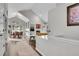 Bright living room with a vaulted ceiling, fireplace, and large windows at 2295 S Depew St, Denver, CO 80227