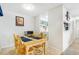 Bright dining area with a view of the kitchen at 3600 S Pierce St # 7-104, Denver, CO 80235