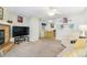 Cozy living room features a fireplace and sliding glass door leading to patio at 3600 S Pierce St # 7-104, Denver, CO 80235