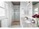 Bathroom with a walk-in shower, granite countertops, chrome fixtures and natural lighting at 7307 S Birch St, Centennial, CO 80122