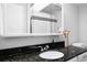 Bathroom featuring a granite countertop, updated fixtures, and a stylish decorative flower vase at 7307 S Birch St, Centennial, CO 80122