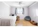 Cozy bedroom featuring a ceiling fan, a comfortable bed, and a window with natural light at 7307 S Birch St, Centennial, CO 80122