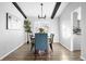 Dining room with black beam ceilings and modern decor at 7307 S Birch St, Centennial, CO 80122