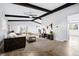 Open living room featuring wood beam ceilings, neutral colors and a ceiling fan at 7307 S Birch St, Centennial, CO 80122