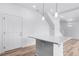 Kitchen island with quartz countertop at 1170 Sugarloaf Ln, Erie, CO 80516