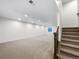 Spacious basement with recessed lighting, carpeted floors, and staircase access at 339 Rocking Chair Dr, Berthoud, CO 80513