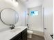 A clean bathroom featuring a shower-tub combo, dark accents, and white subway tile at 339 Rocking Chair Dr, Berthoud, CO 80513