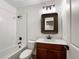 Bathroom featuring a shower over tub, and vanity with dark wood cabinets at 339 Rocking Chair Dr, Berthoud, CO 80513