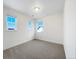 A well-lit bedroom with neutral carpet and three windows providing plenty of natural light at 339 Rocking Chair Dr, Berthoud, CO 80513