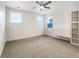 Bedroom with neutral carpet, a ceiling fan, and built-in shelving at 339 Rocking Chair Dr, Berthoud, CO 80513