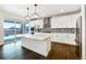 Modern kitchen featuring a center island, stainless steel appliances, and stylish backsplash at 339 Rocking Chair Dr, Berthoud, CO 80513