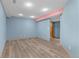 Basement with wood floors and doorway at 9983 Cottoncreek Dr, Highlands Ranch, CO 80130