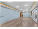 Spacious basement with wood flooring and neutral wall colors at 9983 Cottoncreek Dr, Highlands Ranch, CO 80130