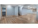 Open basement space with wood-look flooring at 9983 Cottoncreek Dr, Highlands Ranch, CO 80130