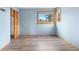 Bright bedroom boasts wood floors and a window with outside views at 9983 Cottoncreek Dr, Highlands Ranch, CO 80130