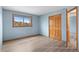 A spacious bedroom with a window and closet at 9983 Cottoncreek Dr, Highlands Ranch, CO 80130