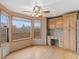 Breakfast nook area with large windows and hardwood floors, featuring custom cabinet and desk space at 9983 Cottoncreek Dr, Highlands Ranch, CO 80130