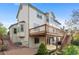 Charming home exterior featuring a spacious deck and well-maintained landscaping at 9983 Cottoncreek Dr, Highlands Ranch, CO 80130