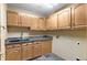 Functional laundry room features a utility sink and built-in cabinets for storage at 9983 Cottoncreek Dr, Highlands Ranch, CO 80130