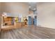 Spacious living room showcases hardwood floors and an open floor plan that leads to the kitchen and entryway at 9983 Cottoncreek Dr, Highlands Ranch, CO 80130