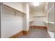 Large walk-in closet with wood trim and shelving at 9983 Cottoncreek Dr, Highlands Ranch, CO 80130