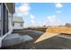 Expansive backyard with new construction featuring privacy fence, and concrete patio off the back door at 250 Lark Sparrow Way, Bennett, CO 80102