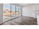 Bright dining area with large sliding glass doors and wood-look floors, perfect for entertaining at 250 Lark Sparrow Way, Bennett, CO 80102
