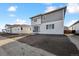 Two-story home showcasing the home's exterior, modern design, and spacious backyard perfect for landscaping at 250 Lark Sparrow Way, Bennett, CO 80102