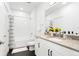 Modern bathroom with subway tiles, dark floors, and a bright, clean aesthetic at 2851 W 52Nd Ave # 404, Denver, CO 80221