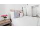 Serene bedroom featuring soft bedding, neutral tones, a window view, and ample natural light at 2851 W 52Nd Ave # 404, Denver, CO 80221
