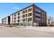 Exterior shot of a modern multi-story building with multiple balconies at 2851 W 52Nd Ave # 404, Denver, CO 80221