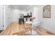 View of a dining area adjacent to the kitchen, featuring clear chairs, and a round table at 2851 W 52Nd Ave # 404, Denver, CO 80221
